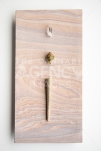 Marijuana Bud, Joint and Crystal on a Desert Stone, Portrait Orientation – Minimalist Cannabis - The Cannabiz Agency